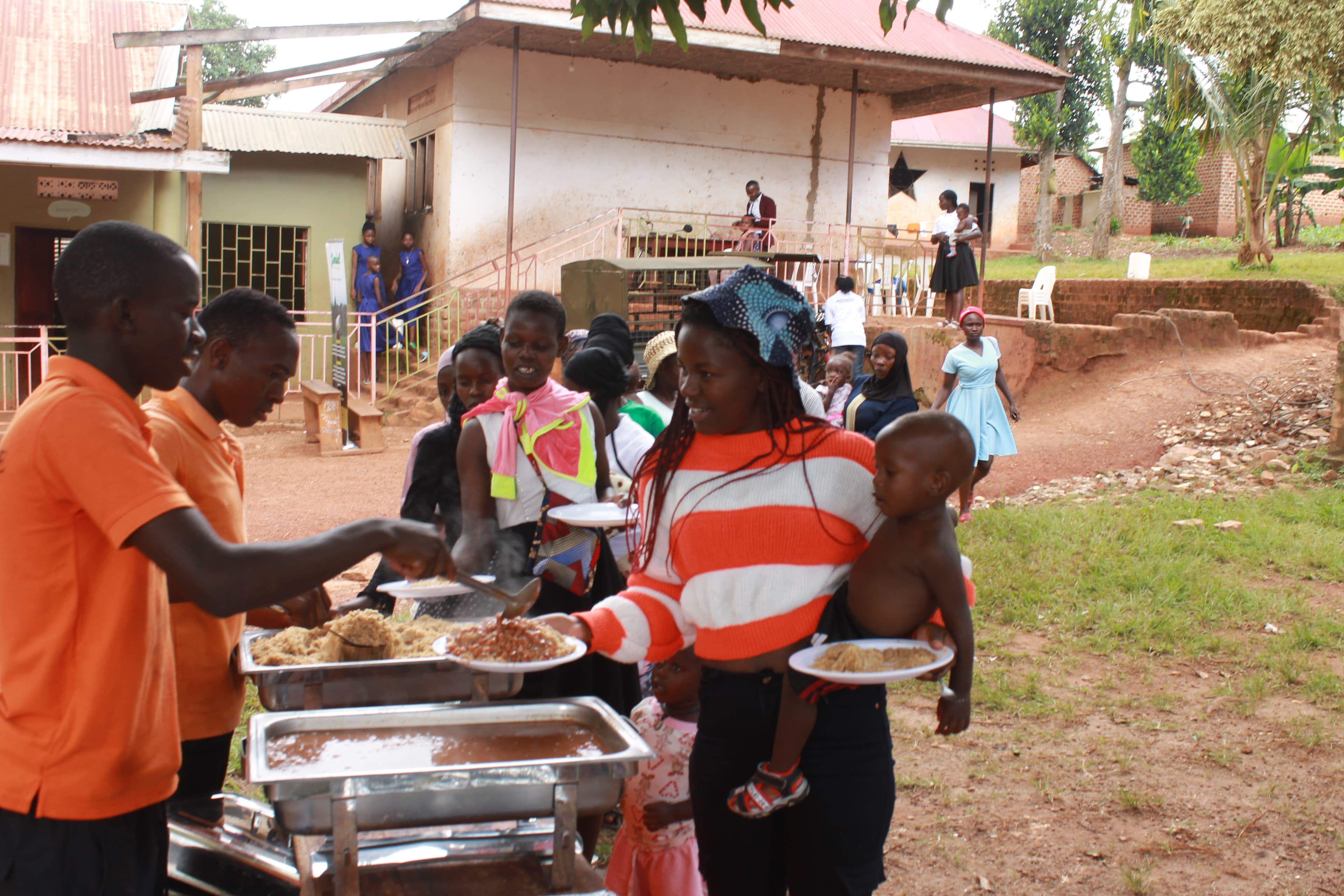 Beneficiaries getting lunch with their children